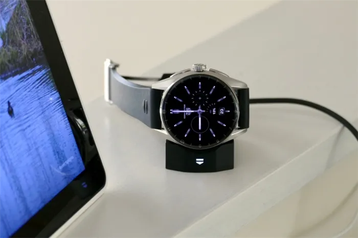 The Tag Heuer Connected Calibre E4 watch on its charging dock.