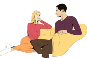 Парень и девушка сидят на диване