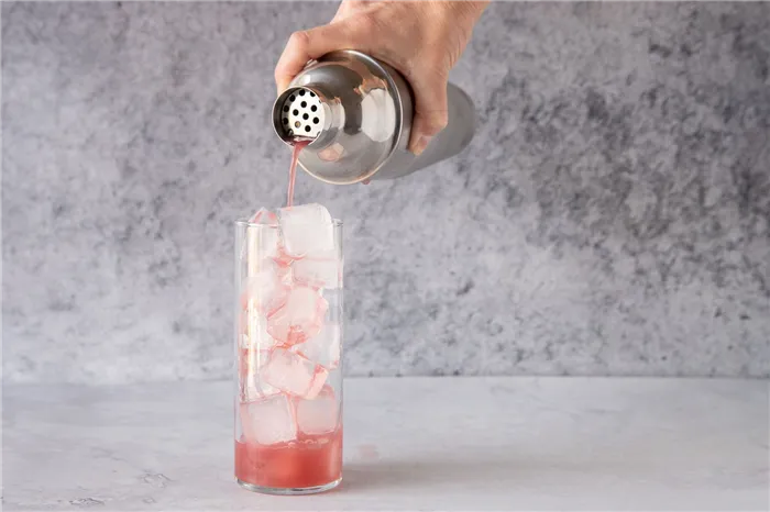 strain the cocktail into a glass with ice 